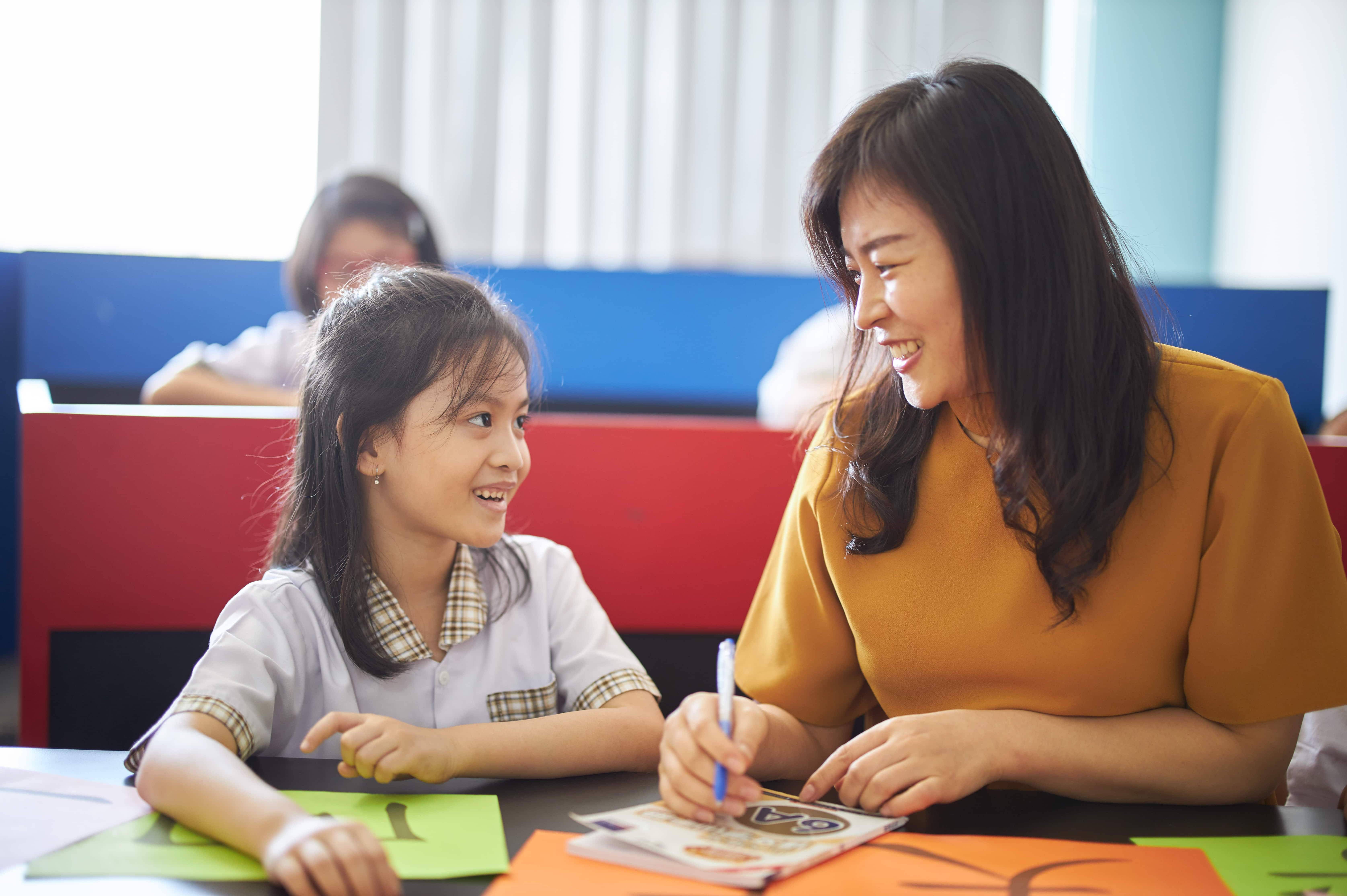 Surabaya Grammar School Student And Teacher